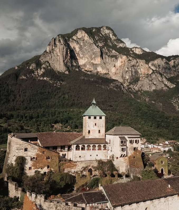 Medieval Castel Ivano surrounded by the Trentino mountains.